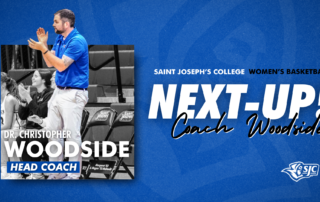 Dr. Christopher Woodside, new women’s hoops coach of the Monks, stands and claps on the sidelines. Text reads “NEXT-UP! Coach Woodside.”. Saint Joseph's College of Maine