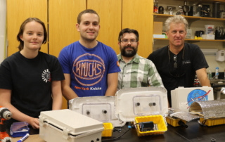 high school students pose with SJC professors Ryan Dorland and Steve Jury