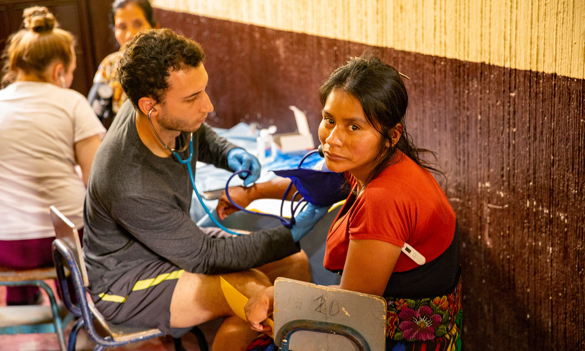 Pre-Medical student volunteers in a clinic