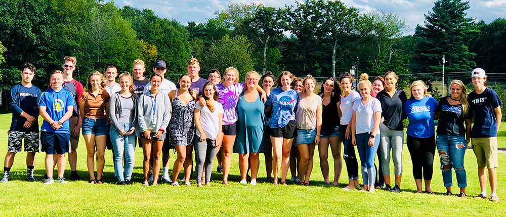 The Power Of Cohort 1 Group photo of the First Year Experience (FYE) Seminar students outside on the lawn with Dr. Marion Young.