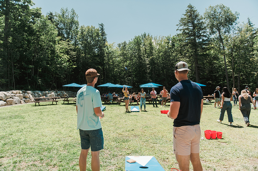 students play games at the lakefront